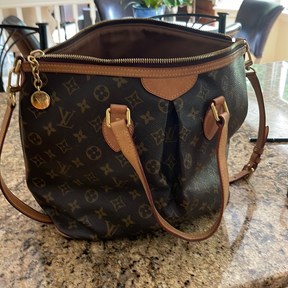 Louis Vuitton medium size purse with shoulder strap.
